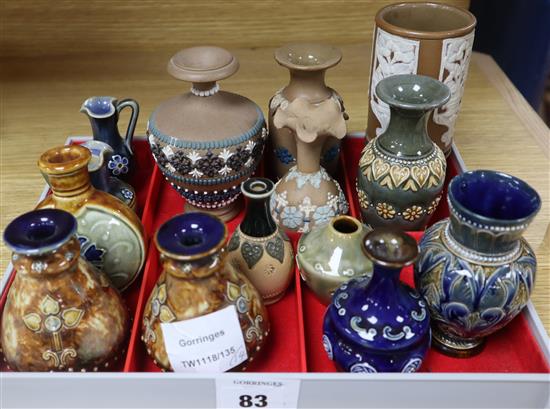 Thirteen Doulton miniature vases and a jug